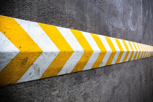 A yellow stripe speed ramp on concrete road