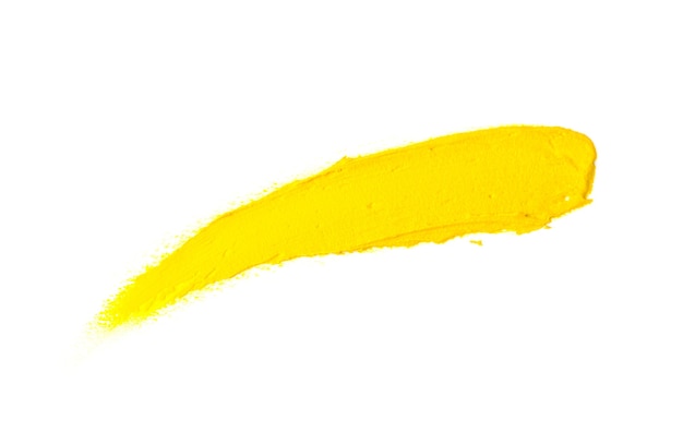 Yellow stroke of the paint. Isolated on white. Trending color of 2021. Smear of colors of the year.