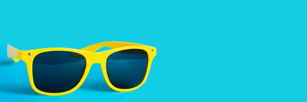 Yellow sunglasses with copy space, concept of summer and vacation