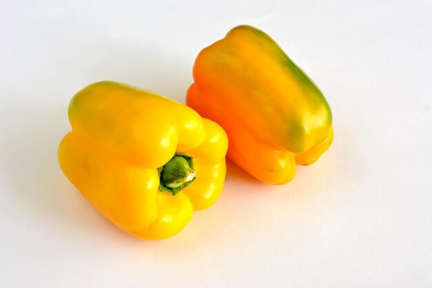 Yellow sweet peppers isolated on white background, macro