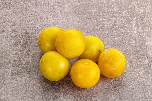 Yellow sweet ripe plum heap fruit