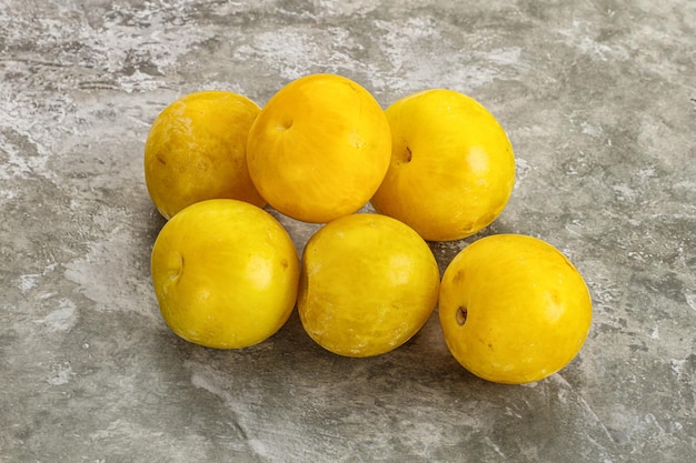 Yellow sweet ripe plum heap fruit