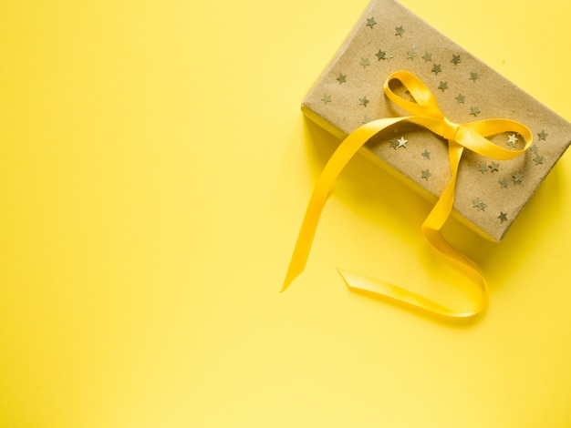 Yellow tape along the yellow background. Confetti star framing