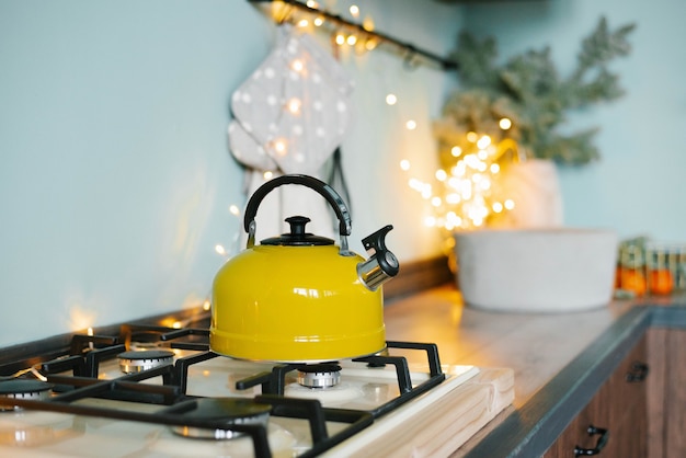 A yellow teapot stands on the stove in the kitchen