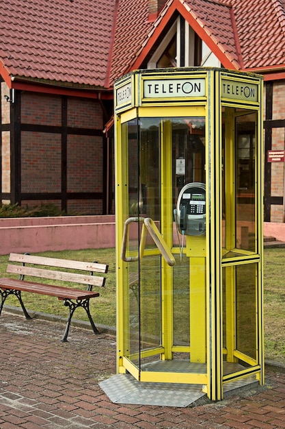 A yellow telephone booth with the word telonn on it