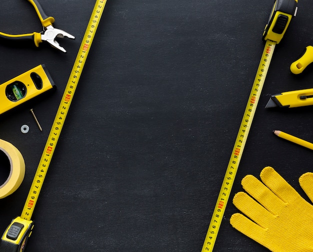 Yellow tools and construction glove with copy space