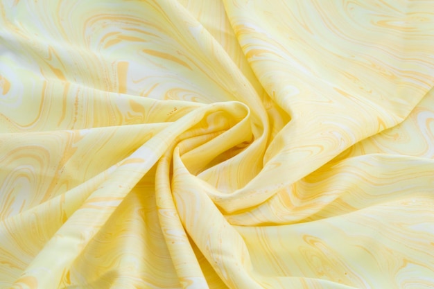 Yellow top view of base color silk, fabric with Yellow marble pattern silk, wavy, spiral, crease, swirl, backdrop, cloth background, have copy space for text