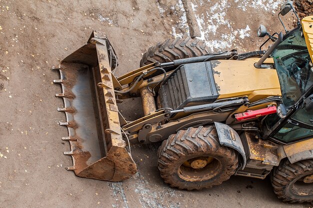 Yellow tractor for road works