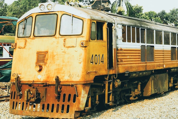 Yellow train Thailand train Procession yellow Train led by diesel electric locomotive on the tracks from Thailand