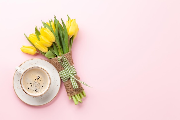 Yellow tulip flowers bouquet and coffee