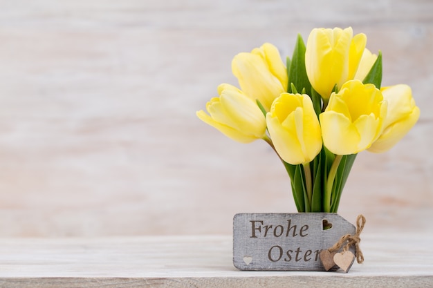 Yellow tulips, spring flowers and Easter decoration.