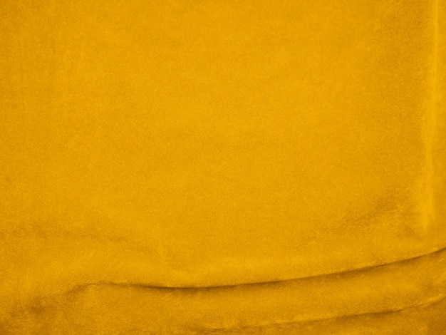 Текстура желтой бархатной ткани используется в качестве фона Пустой желтый фон ткани из мягкого и гладкого текстильного материала Есть место для текста