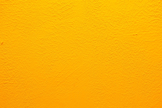 Yellow wall texture. Bright warm yellow wall background.