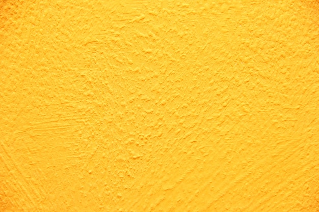 Yellow wall texture. Bright warm yellow wall background.