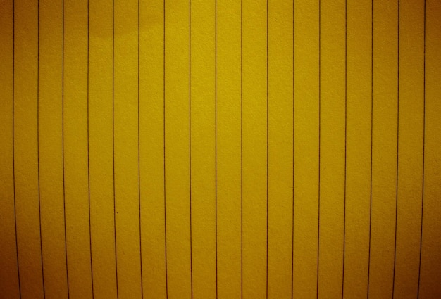 A yellow wall with a vertical stripe that says's a lot of space '