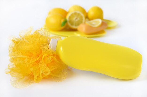 Yellow washcloth and shower gel close up