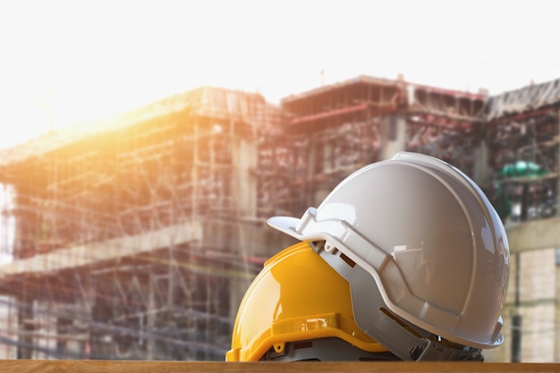 yellow and white helmet safety in construction site 