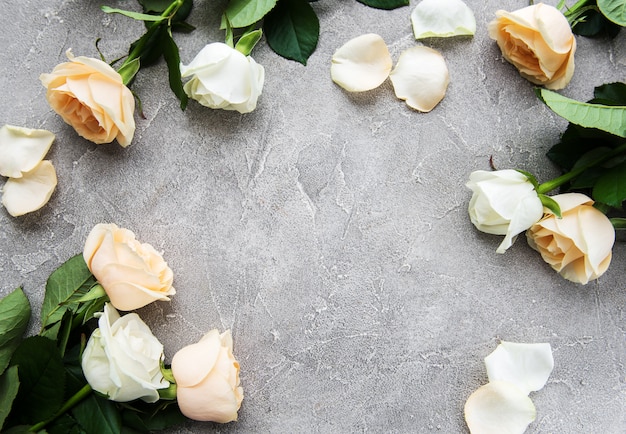 Yellow and white roses on a stone background