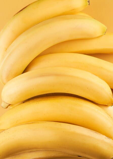 Yellow whole bananas close up background