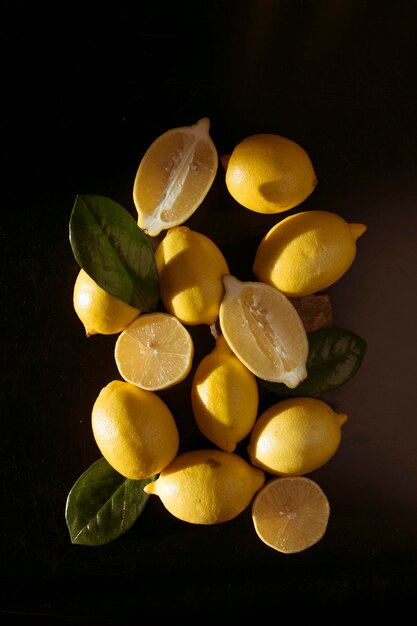 Yellow whole and sliced lemons Isometric view of a minimal still life