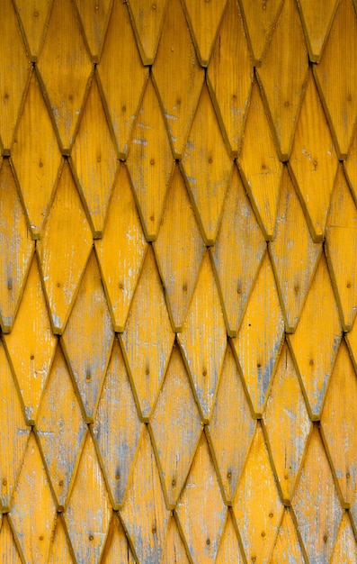 Yellow wooden tiling rough rustic background Tonned vertical