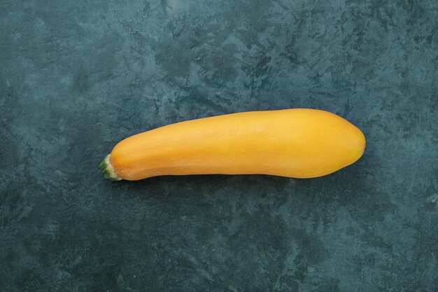 Yellow zucchini on kitchen table