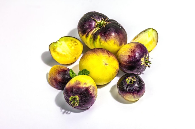 Yellowviolet Tomatoes variety Primary colors isolated on white background