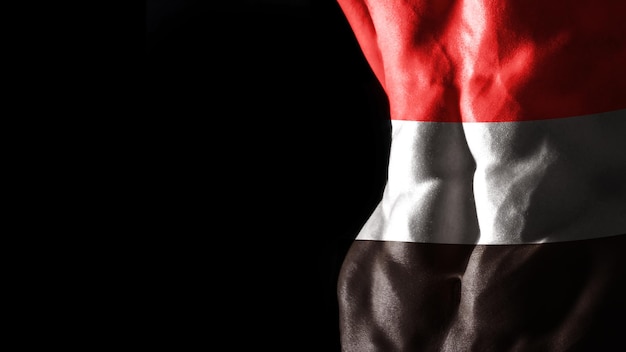 Флаг Йемена на национальной спортивной тренировке мышц пресса, концепция бодибилдинга, черный фон