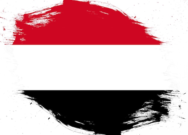 Yemen flag on distressed grunge brush background