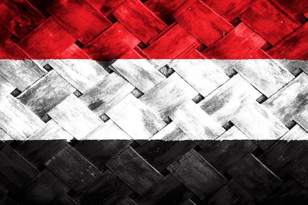 Yemen flag screen on wicker wood background