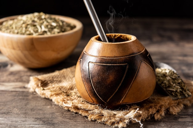 Yerba mate tea on wooden table. Traditional Argentinian beverage