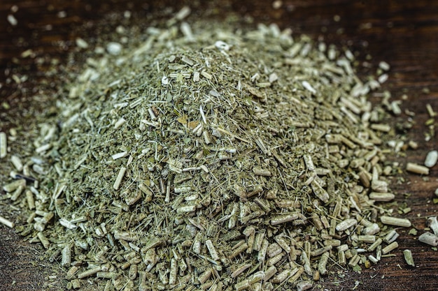Yerba mate on wooden surface. Herb used for chimarrÃ£o tea typical of south america