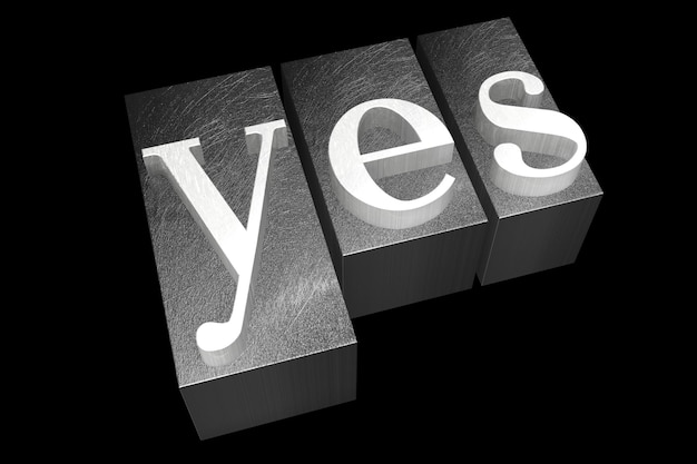 Photo yes metal letterpress word isolated on black background