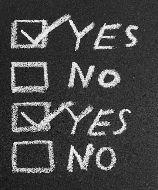 Photo yes no check box by chalk in black slate