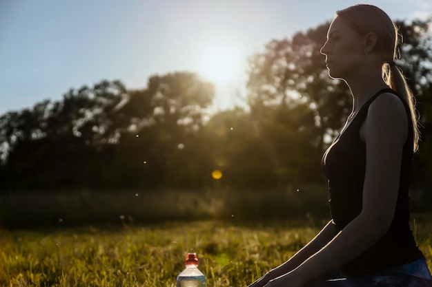 Yoga on a background of nature Rest and relaxation Sunset