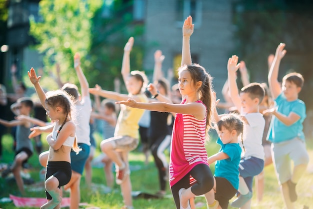 Yoga classes outside on the open air. Kids Yoga,