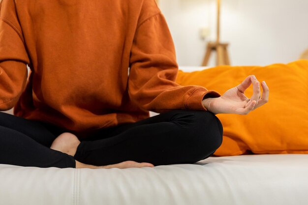 Yoga mindfulness meditation woman hands in chin mudra gesture african girl practicing yoga at home