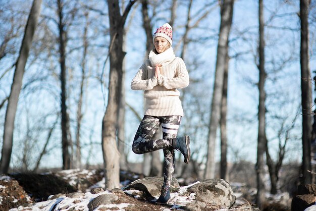 Yoga outdoor Happy woman doing yoga exercises Yoga meditation in nature