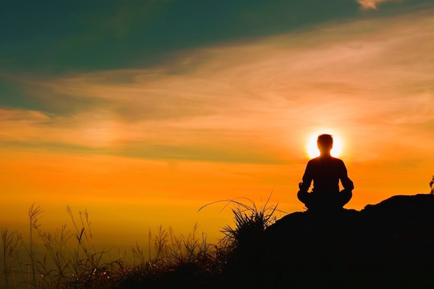 Yoga practicioner during the sunset meditation