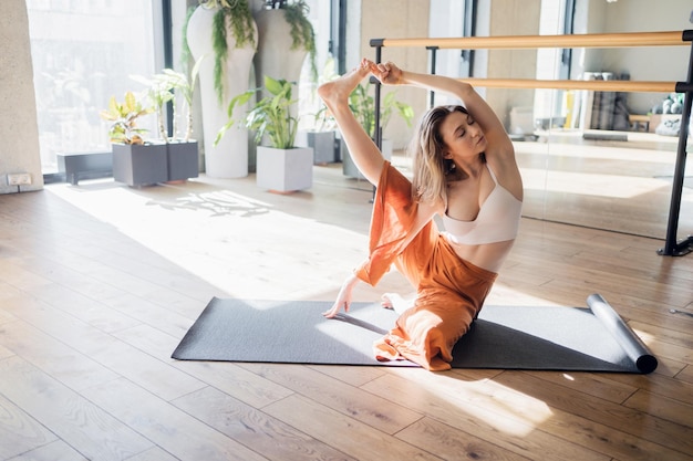 Yoga training in a fitness club asana exercises for balance and harmony of the body