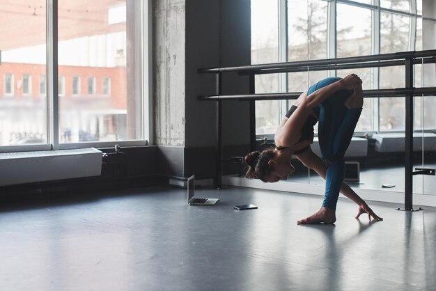 Yoga. Woman doing exercises in the gym