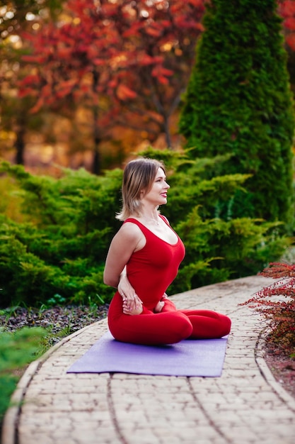 Yoga woman on green grass