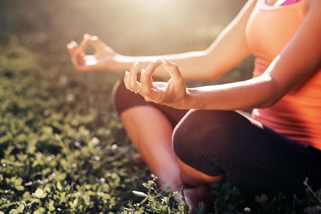 Yoga Young woman practicing yoga or dancing or stretching in nature at park Health lifestyle concept