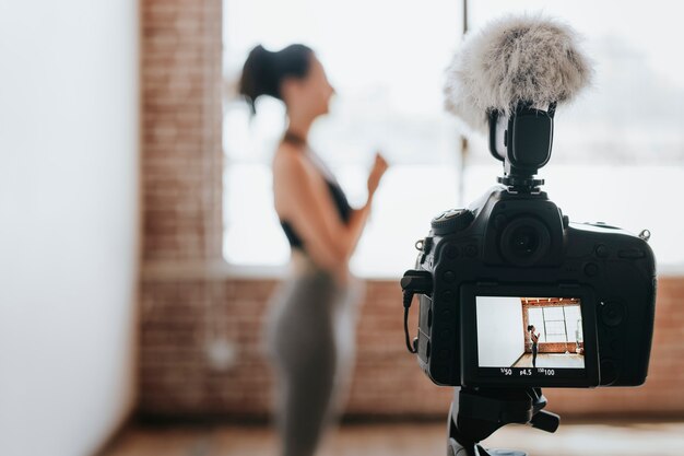 Yogini filming herself at a studio