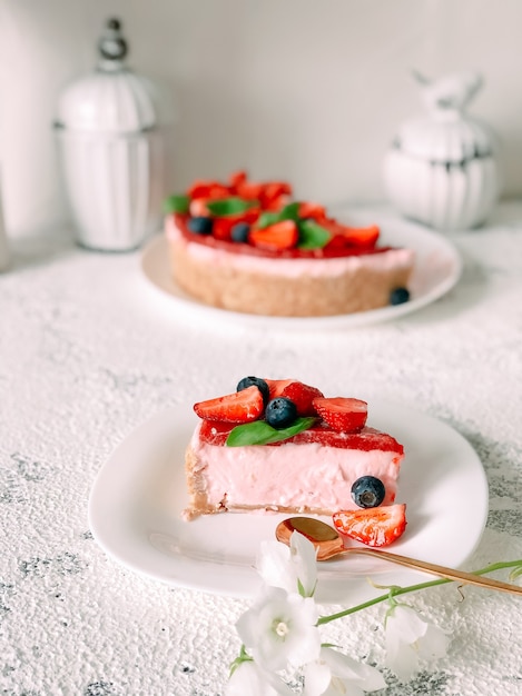 Yogurt cake with strawberries, blueberries and mint