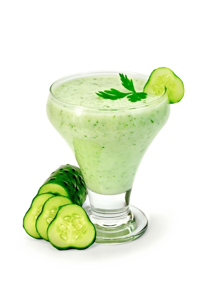 Yogurt in a glass with a cucumber and parsley isolated on a white