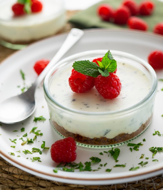 Yogurt and mint mousse served in a glass with a crushed cookie base