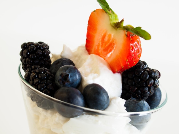 Yogurt parfait with blueberries, blackberries, strawberries, and Granola.