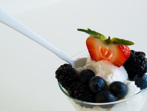 Yogurt parfait with blueberries, blackberries, strawberries, and Granola.