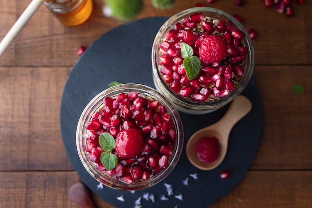 Yogurt parfait with red fruits Dessert based on yogurt raspberries and pomegranate